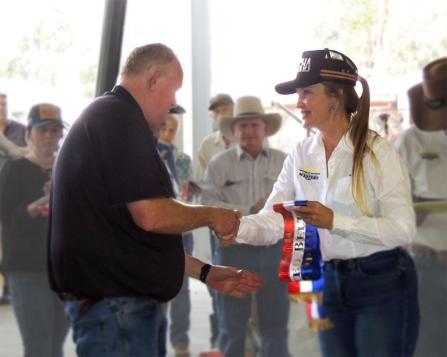 Eloise Johnson awarding a sash for the Plaited belt 