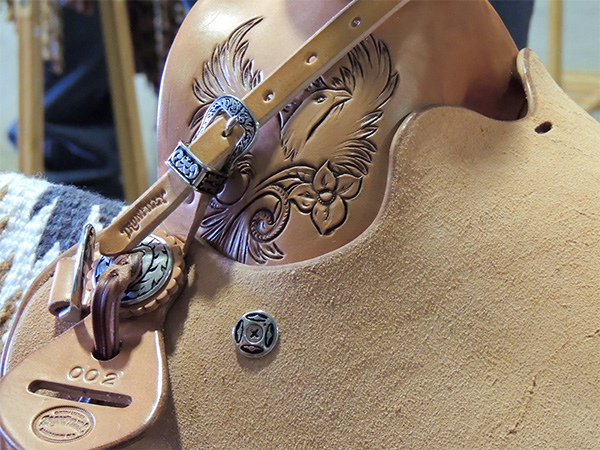 Clos up of leather carving on Phoebe Trigger's winning saddle