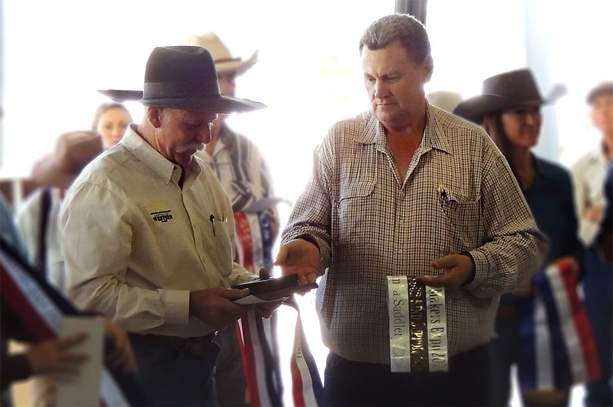 Rob Delbridge handing Trevor Able his award