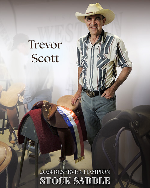 Trevor Scott standing with his winning stock saddle